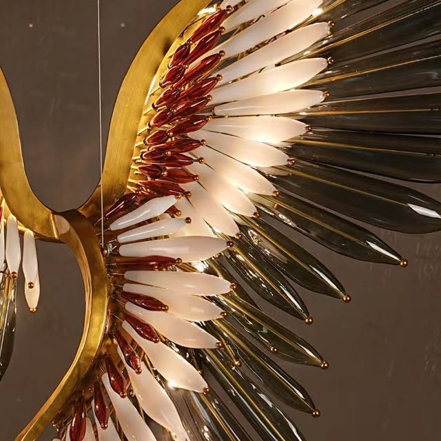 Phoenix glass elements form a luminous wing on a metal frame.
